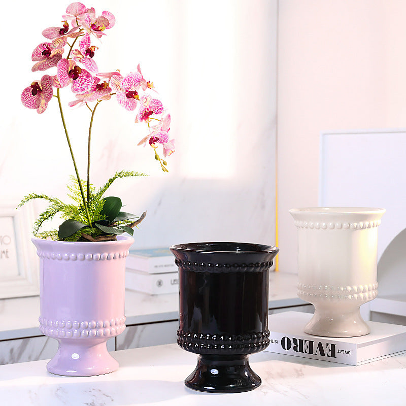High-legged ceramic perforated flowerpot