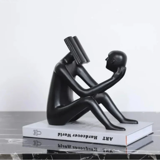 Abstract Seated Figure Sculpture Holding a Head