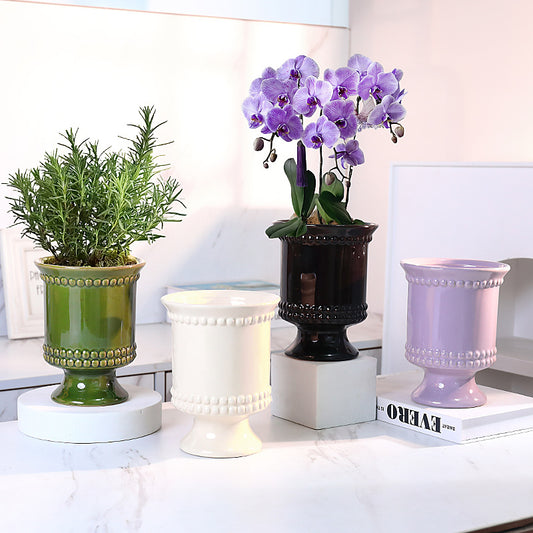 High-legged ceramic perforated flowerpot