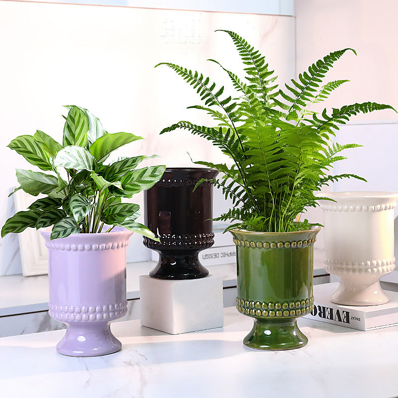 High-legged ceramic perforated flowerpot